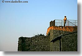 europe, gates, horizontal, italy, looking, men, over, sorano, towns, tuscany, photograph