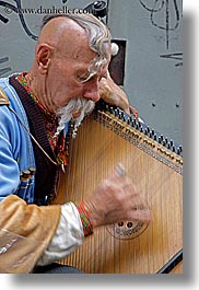 images/Europe/Poland/Krakow/People/Men/man-playing-odd-harp-5.jpg