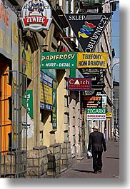 europe, krakow, pedestrians, people, poland, signs, vertical, photograph