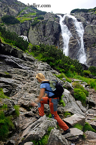 woman-hiking-by-waterfall.jpg
