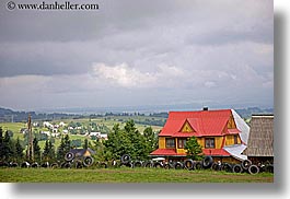 images/Europe/Poland/Zakopane/Buildings/house-w-tire-fence.jpg
