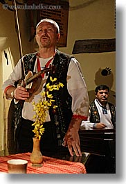 artists, europe, flowers, gypsy music, men, music, musicians, nature, people, players, singing, slovakia, vertical, violins, photograph