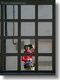 europe, kobarid, men, photographers, reflections, self portrait, slovenia, vertical, windows, photograph