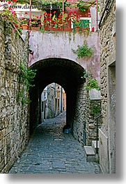 arches, archways, cobblestones, europe, flowers, pirano, slovenia, vertical, photograph