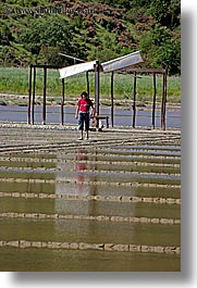 europe, flats, men, pirano, salt, salt flats, slovenia, vertical, walk, windmills, photograph