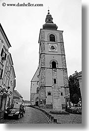 bell towers, black and white, cobblestones, europe, ptuj, slovenia, vertical, photograph