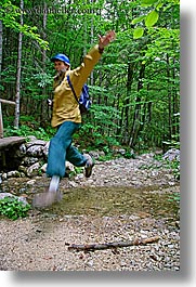 christie, europe, groups, hikers, hiking, jumping, men, slovenia, stream, stuart, vertical, photograph