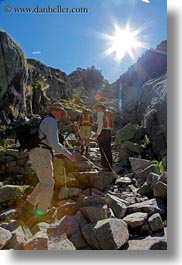 activities, aiguestortes hike, europe, hikers, hiking, mountains, nature, people, rocks, spain, sun, vertical, photograph