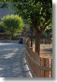 ansovell, europe, fences, motorcycles, picket, spain, vertical, photograph