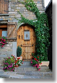 arches, doors, echo, europe, flowers, spain, vertical, woods, photograph