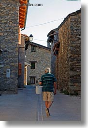 estamariu, europe, men, spain, streets, vertical, walking, photograph