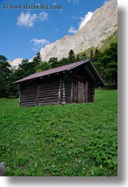 europe, gasterntal valley, grass, green, houses, kandersteg, mountains, switzerland, vertical, photograph