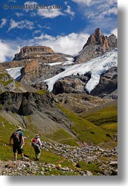 clouds, europe, hikers, hiking, kandersteg, lake oeschinensee, mountains, nature, people, sky, snowcaps, switzerland, vertical, photograph