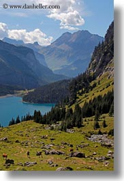 clouds, europe, hikers, hiking, kandersteg, lake oeschinensee, mountains, nature, people, sky, switzerland, vertical, photograph