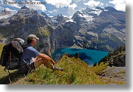 clouds, europe, hikers, horizontal, kandersteg, lake oeschinensee, lakes, men, mountains, nature, oeschinensee, people, sky, snowcaps, switzerland, photograph