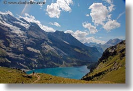 clouds, europe, hikers, horizontal, kandersteg, lake oeschinensee, lakes, mountains, nature, oeschinensee, people, sky, snowcaps, switzerland, photograph