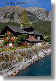 europe, flowers, houses, kandersteg, scenics, switzerland, vertical, photograph