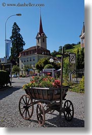 carts, churches, europe, lucerne, steeples, switzerland, vertical, weggis, photograph
