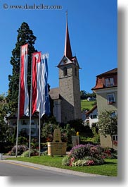 churches, europe, flags, lucerne, steeples, switzerland, vertical, weggis, photograph