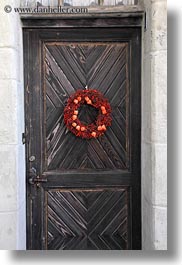 doors, europe, flowers, montreaux, st saphorin, switzerland, vertical, woods, wreath, photograph