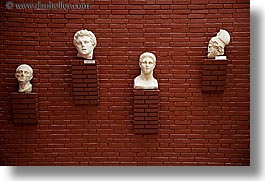 images/Europe/Turkey/EphesusMuseum/stone-statue-heads-on-wall-1.jpg