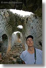 architectural ruins, archways, caverns, europe, gemiler, people, turkeys, vertical, viewing, photograph