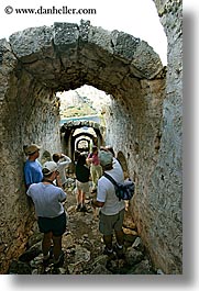 architectural ruins, archways, caverns, europe, gemiler, people, turkeys, vertical, viewing, photograph