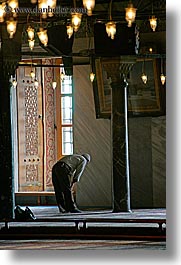 blue mosque, europe, istanbul, men, mosques, muslim, praying, religious, turkeys, vertical, photograph