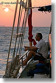 boats, europe, mahmut, men, ocean, sun, sunsets, tourists, turkeys, vertical, photograph