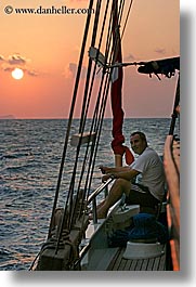 boats, europe, mahmut, men, ocean, sun, sunsets, tourists, turkeys, vertical, photograph