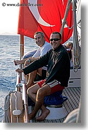 boats, europe, flags, mahmut, men, tanner, tourists, turkeys, vertical, photograph