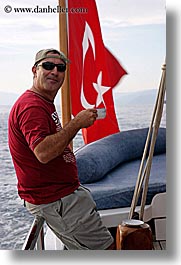 boats, europe, flags, mahmut, men, tourists, turkeys, vertical, photograph