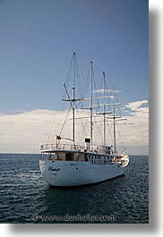 boats, days, ecuador, equator, galapagos, galapagos islands, heritage, islands, latin america, ocean, pacific ocean, south pacific, vertical, water, photograph