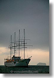 boats, ecuador, equator, eve, evening, galapagos, galapagos islands, heritage, islands, latin america, ocean, pacific ocean, south pacific, vertical, water, photograph