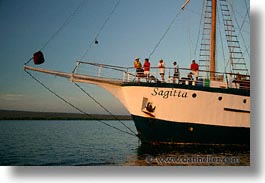 boats, ecuador, equator, galapagos, galapagos islands, horizontal, islands, latin america, ocean, pacific ocean, people, sagitta, sails down, south pacific, water, photograph