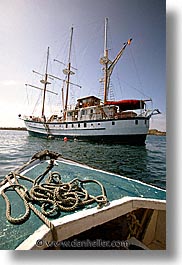 boats, ecuador, equator, galapagos, galapagos islands, islands, latin america, ocean, pacific ocean, ropes, sagitta, sails down, south pacific, vertical, water, photograph