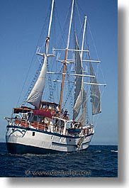 boats, ecuador, equator, galapagos, galapagos islands, islands, latin america, ocean, pacific ocean, sagitta, sails, sails up, south pacific, vertical, water, photograph