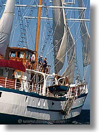 boats, ecuador, equator, galapagos, galapagos islands, islands, latin america, ocean, pacific ocean, sagitta, sails, sails up, south pacific, vertical, water, photograph