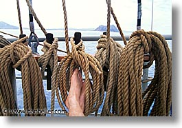 boats, ecuador, equator, feet, galapagos, galapagos islands, horizontal, islands, latin america, ocean, pacific ocean, ropes, south pacific, water, photograph