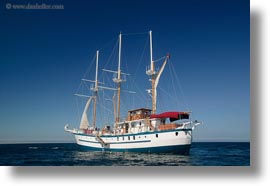 boats, ecuador, equator, galapagos islands, horizontal, latin america, sagitta, sails, sails up, photograph