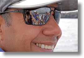 baseball cap, ecuador, equator, galapagos islands, gustavo, horizontal, latin america, natural habitat, people, smiles, sunglasses, tour guides, photograph