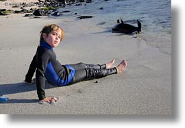 beaches, ecuador, equator, galapagos islands, horizontal, jacks, latin america, natural habitat, ocean, people, sand, sea lions, tourists, wetsuit, photograph