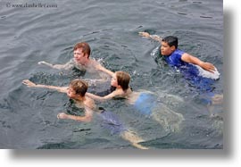 boys, ecuador, equator, galapagos islands, horizontal, jacks, latin america, natural habitat, ocean, people, swimming, tourists, water, photograph