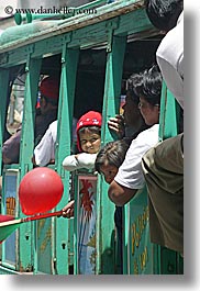 childrens, clothes, colors, ecuador, emotions, equator, girls, green, hats, latin america, quito, red, smiles, trains, vertical, photograph