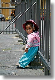 blues, childrens, clothes, colors, ecuador, equator, fences, girls, hats, latin america, pink, quito, toddlers, vertical, photograph