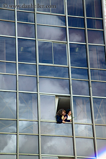 women-looking-out-glass-bldg.jpg