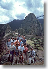 ancient ruins, andes, architectural ruins, groups, inca trail, incan tribes, latin america, machu, mountains, people, peru, stone ruins, vertical, photograph