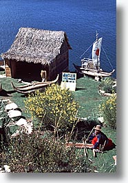 boats, bolivia, bolivia/peru border, highest lake in the world, lakes, latin america, peru, peru border, reed, reed boats, titicaca, vertical, photograph