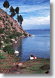 bolivia, bolivia/peru border, clothes, highest lake in the world, lakes, latin america, peru, peru border, taquile, titicaca, vertical, washing, photograph