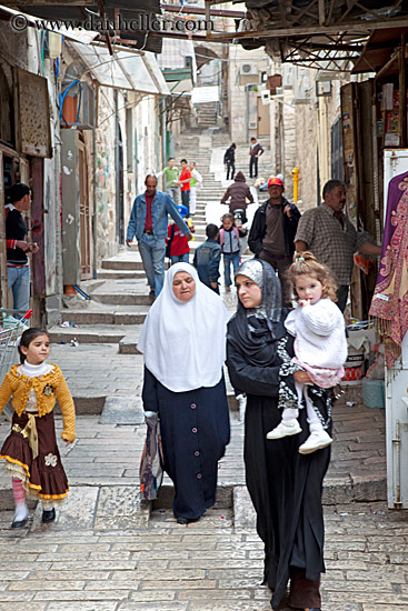 muslim-woman-carrying-girl-1.jpg